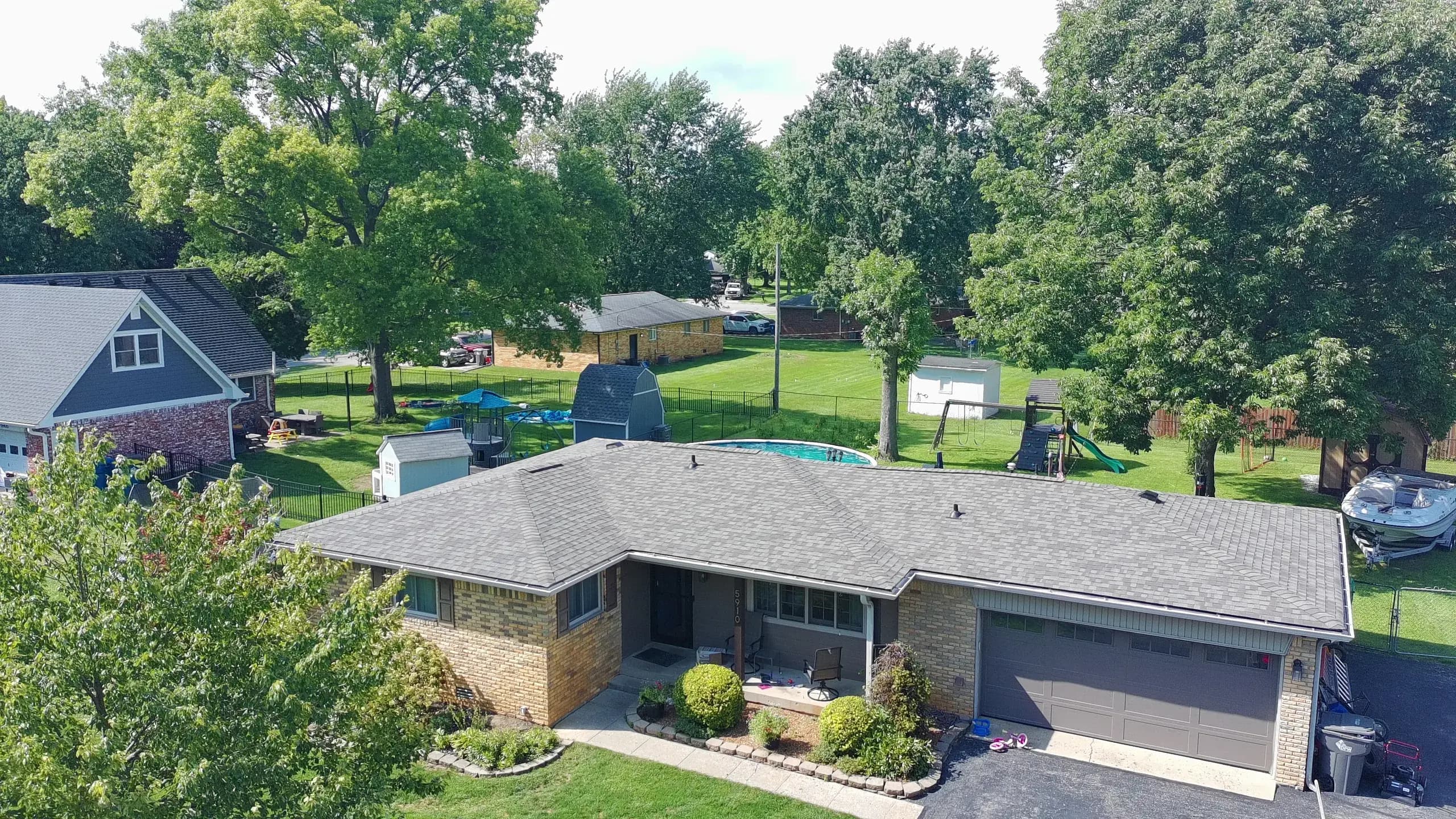 Aerial view of a completed 317 Roofing Co. roof replacement on a ranch home in Central Indiana