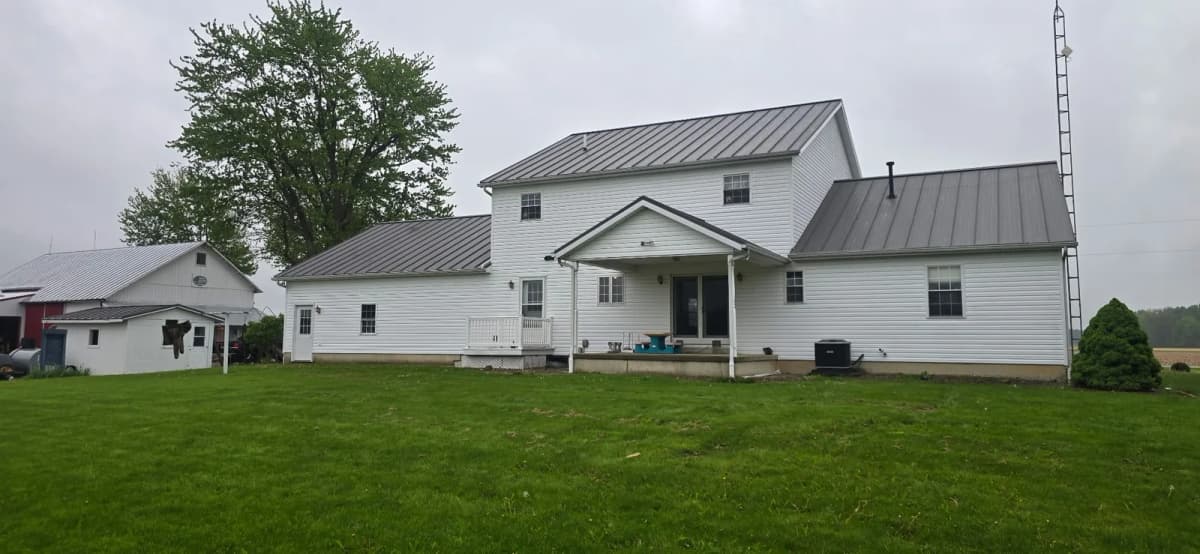 Standing-seam metal roof on the back of a Greenwood, IN home