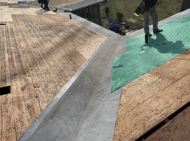 317 Roofing Co. crew nailing architectural shingles to manufacturer pattern